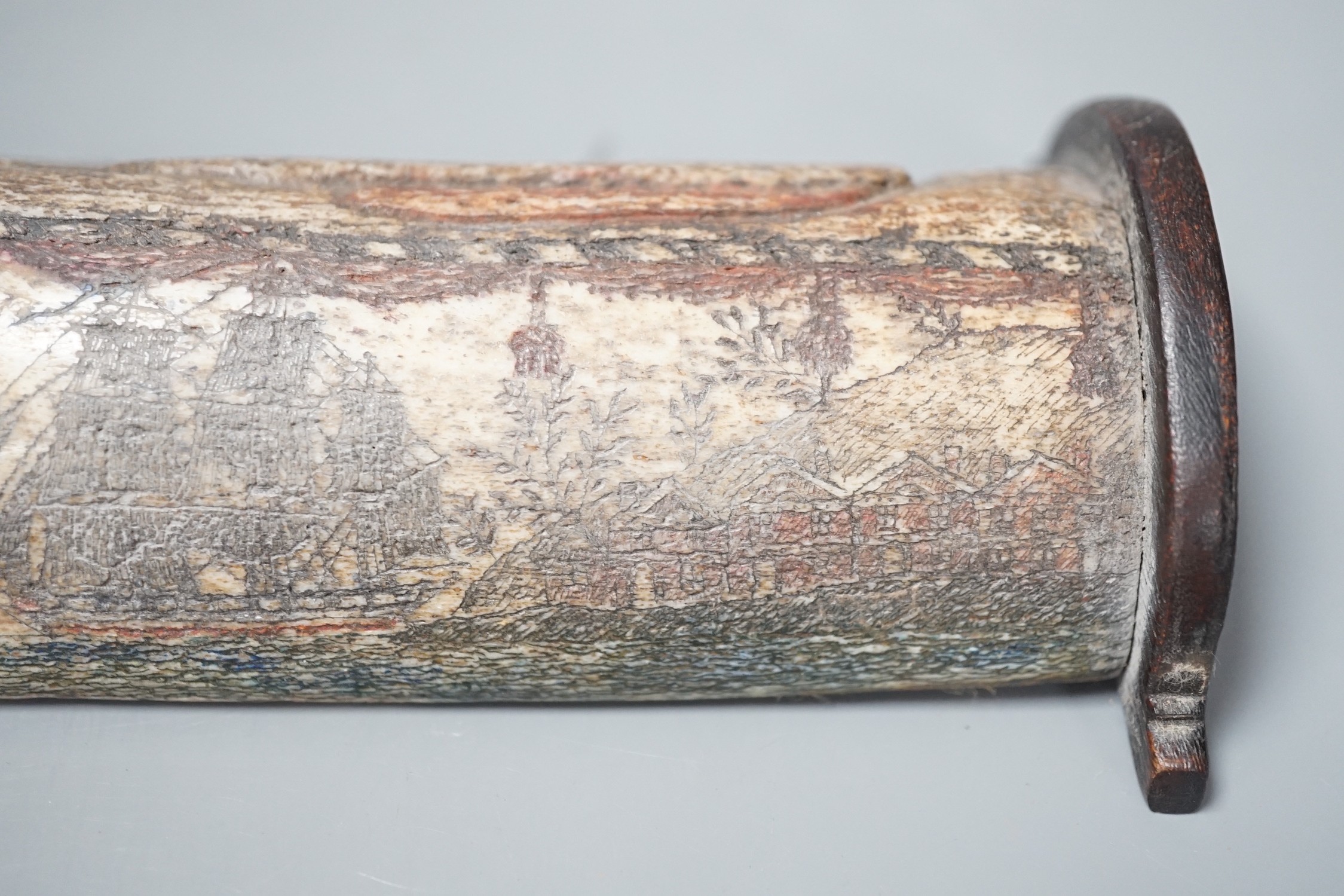 An 18th/early 19th century scrimshaw whale bone carving, 19cm